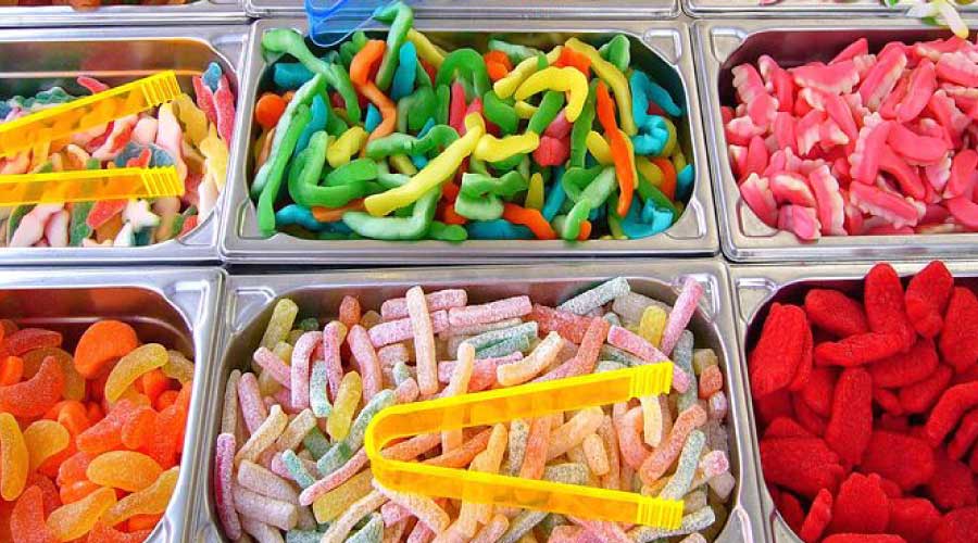 Dishes of colorful gummy candies, one of the worst foods for teeth