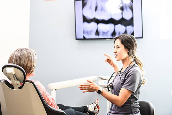 staff speaking with patient