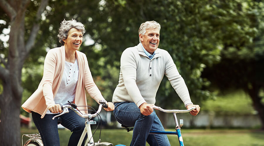 senior couple riding bikes