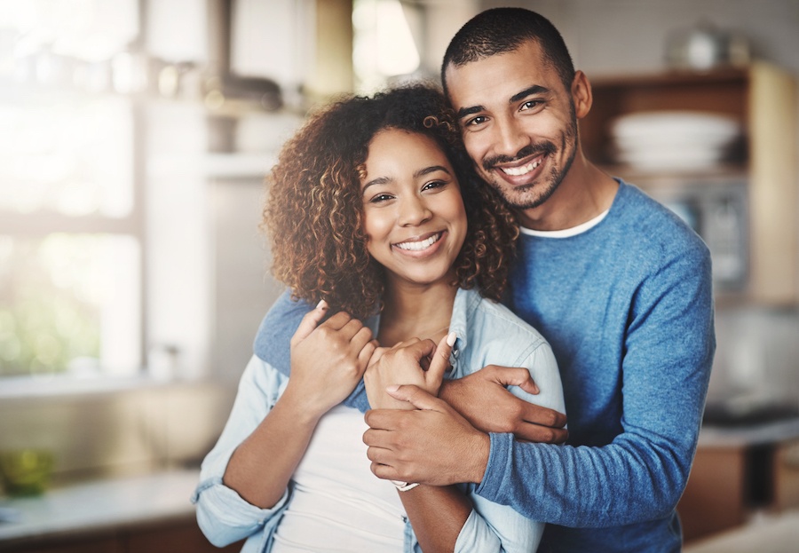 smiling Black couple, cosmetic dentistry