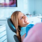 how often should you visit the dentist, woman in dental chair