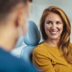 woman discussing dental extraction or root canal or wisdom teeth removal with her dentist