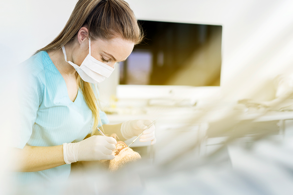 dental associate with patient